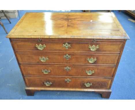 AN 18TH CENTURY WALNUT CROSSBANDED CHEST OF FOUR LONG DRAWERS, with brushing slide, brass loop handles and bracket feet suppo