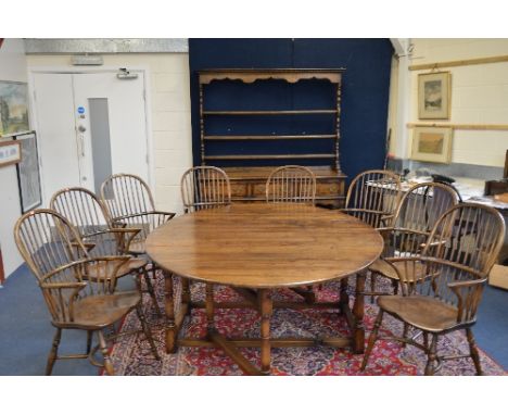 A LARGE RECENT OAK DROP-LEAF DINING TABLE, with gate-leg action and single drawer, approximate extended size length 208cm, wi