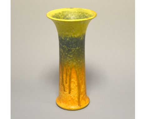 RUSKIN POTTERY, a vase of footed and flared cylindrical form decorated in orange, green and yellow glaze, designed by William