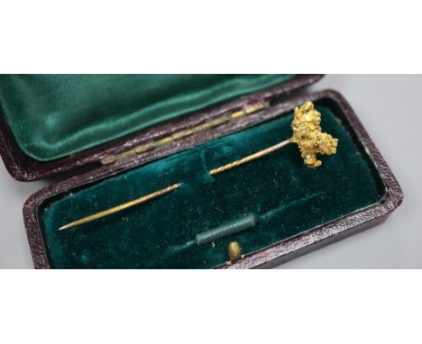 A Victorian yellow metal "nugget" stick pin, 67mm.