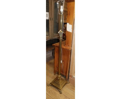 A brass Corinthian column adjustable standard lamp