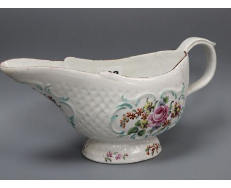 An early Derby polychrome sauceboat, c.1758, patch marks,