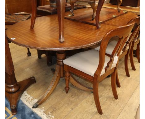 A Regency design twin pillar mahogany dining table 210cm extended (one spare leaf)