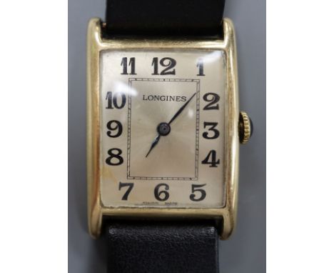 A gentleman's 14k yellow metal Longines manual wind wrist watch, with rectangular Arabic dial, on later associated strap, wit