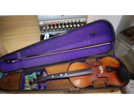 A German early 20th century violin and bow in a walnut inlaid case