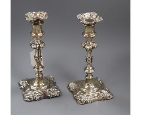 A pair of Victorian rococo style silver candlesticks, Henry Wilkinson &amp; Co, Sheffield 1843/4, 22.5cm.