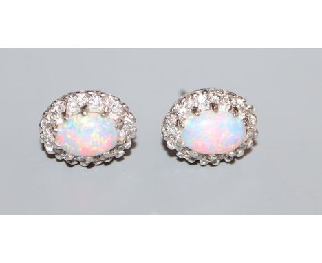 A pair of 18k white metal, white opal and diamond oval cluster ear studs, 11mm.