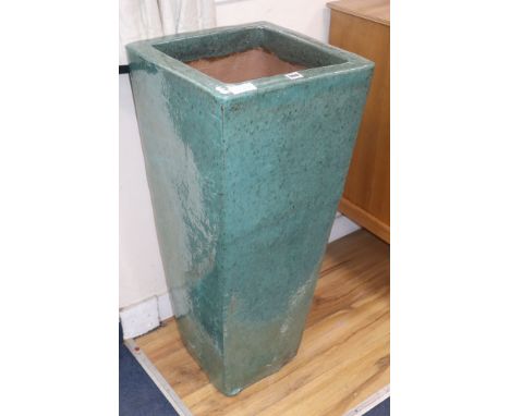 A tall green garden planter H.90cm