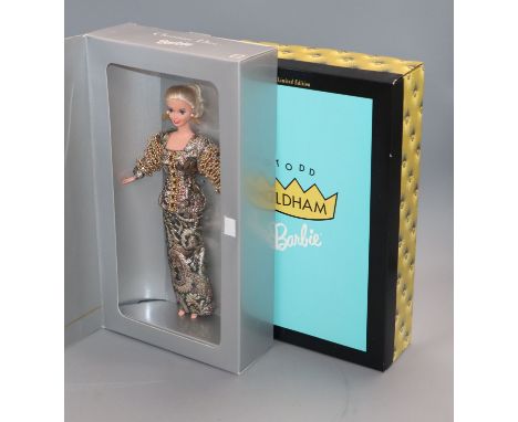 Four Barbie dolls: Christian Dior, Cynthia Rowley, Todd Oldham and Armani
