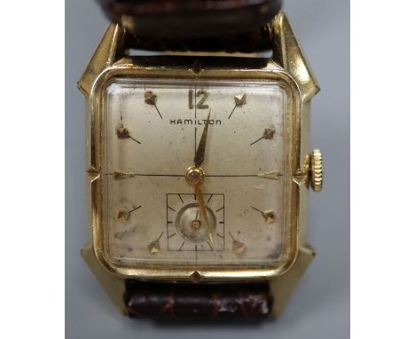 A gentleman's 10k gold filled Hamilton rectangular cased manual wind wrist watch, on later associated leather strap.