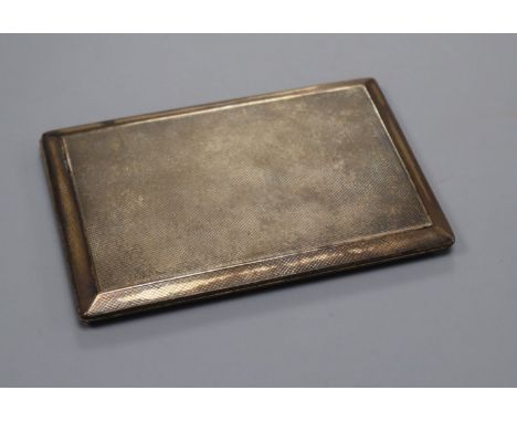 A George V silver engine turned cigarette case, 12.8cm.