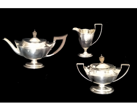 Early 20th century Sterling tea set, comprising of creamer, tea pot and lidded sugar pot, all marked hallmarked  sterling Shr