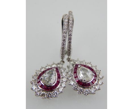 A pair of 18ct white gold, ruby and rose cut diamond drop earrings.