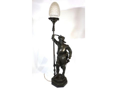 A late Victorian painted lamp base, modelled as a standing Spanish knight with lance, on octagonal plinth. H. 76cm