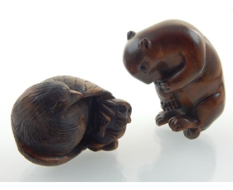 A hardwood netsuke, modelled as a rat, bears signature to base, together with another, modelled as a monkey and a bird, signe