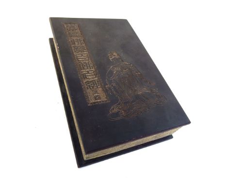A Chinese book, jade inlaid pages with Chinese script.  