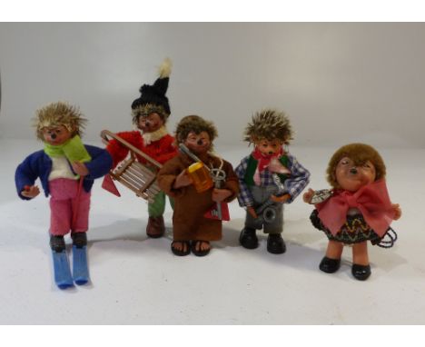 A group of five Steiff style Mecki, Micki hedgehogs, two bearing Peter Austria plastic tags; Friar Skier, tobogganer, saxopho