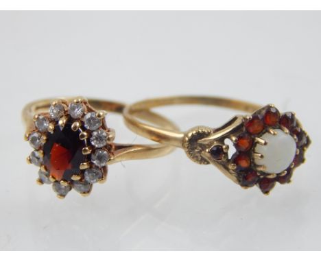 A 9ct yellow gold, garnet and white sapphire cluster ring, together with a 9ct yellow gold, garnet and opal dress ring. 