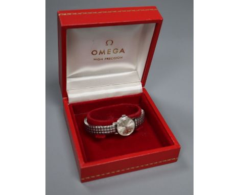 A lady's stainless steel Omega manual wind wrist watch, on associated flexible strap, case diameter 22mm ex. crown, with Omeg