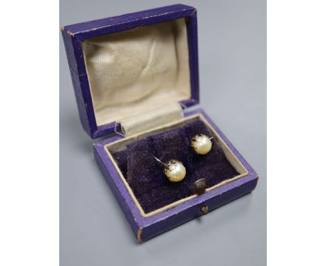 A pair of yellow metal and cultured pearl ear clips, pearl diameter 7.4mm.