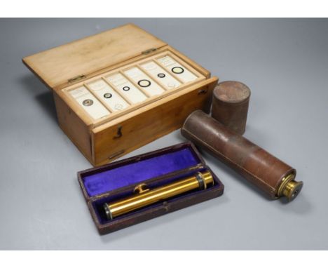 A Victorian cased microscope slides, a leather-cased three drawer telescope and a leather-cased optical instrument