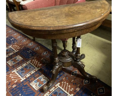 A Victorian inlaid walnut demi-lune folding card table, width 90cm, depth 44cm, height 70cm