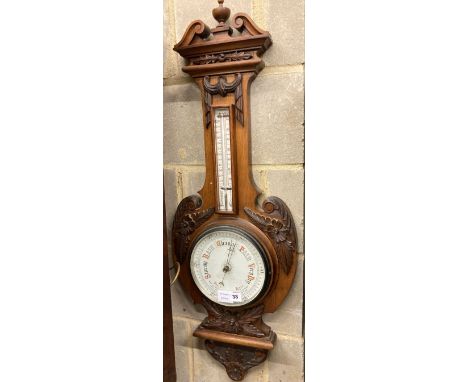 An Edwardian walnut aneroid wheel barometer / thermometer, height 98cm