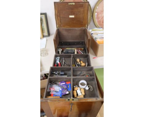 A Brooks Patent mahogany tool cabinet containing a quantity of tools