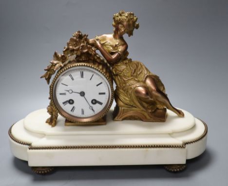 A Louis XVI style white marble mantel clock, with seated female surmount, French bell-striking movement, width 34cm