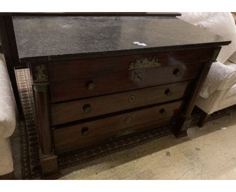 A French Empire ormolu mounted mahogany marble topped commode, fitted four long drawers, width 131cm, depth 63cm, height 92cm