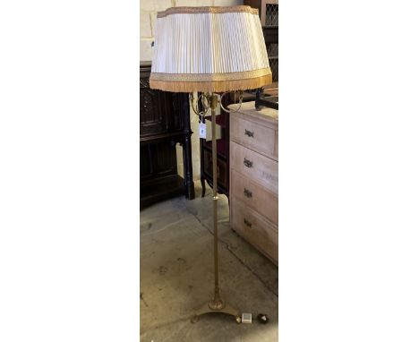 A brass standard lamp with French Horn light holders, height 174cm