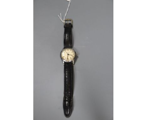 A gentleman's 1950's steel Longines manual wind wrist watch, on later strap, case diameter 34mm, movement c.12.68ZS.CONDITION