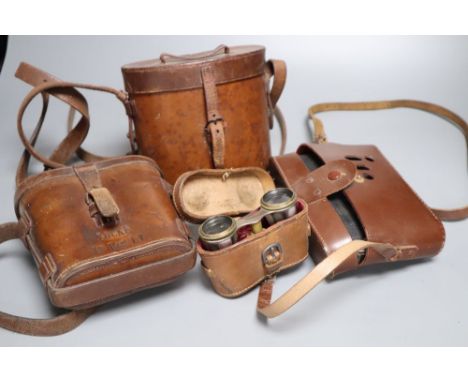 A pair of cased opera glasses, two pairs of cased binoculars and a Zeiss Ikon Nettar cased camera