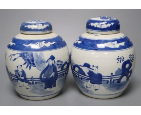 A pair of Chinese porcelain blue and white jars and covers, Qianlong marks but c.1900, 18cm high