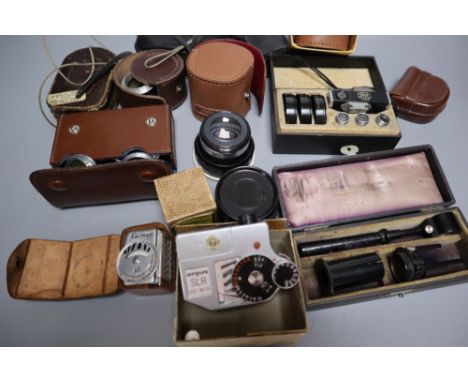 Two boxes of camera lenses and accessories including Voigtlander, Zeiss, Rollei etc