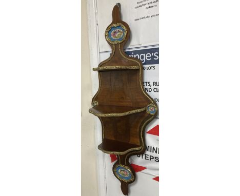 A pair of French mahogany, ormolu and Sevres style porcelain mounted wall shelves, height 90cm
