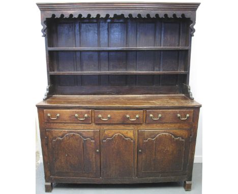 18TH CENTURY AND LATER OAK RACK BACK DRESSER, the panelled two shelf rack back above three drawers and two blind panelled cup