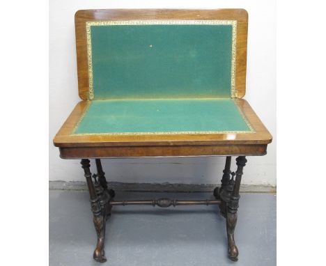 VICTORIAN WALNUT BREAK FRONTED FOLD OVER STRETCHER CARD TABLE, having moulded edged top opening to reveal baize playing surfa