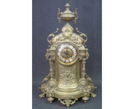 EARLY 20TH CENTURY FRENCH BRASS, ROCOCO STYLE MANTEL CLOCK, the case overall with scrolled foliate mounts, square pillars und