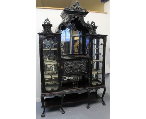 EDWARDIAN EBONISED MAHOGANY DISPLAY CABINET, the central arched, bevel plate mirror flanked by two glazed doors with four vel