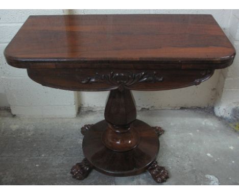 VICTORIAN ROSEWOOD FOLD OVER PEDESTAL CARD TABLE, straight fronted and opening to reveal baize playing surface above a foliat