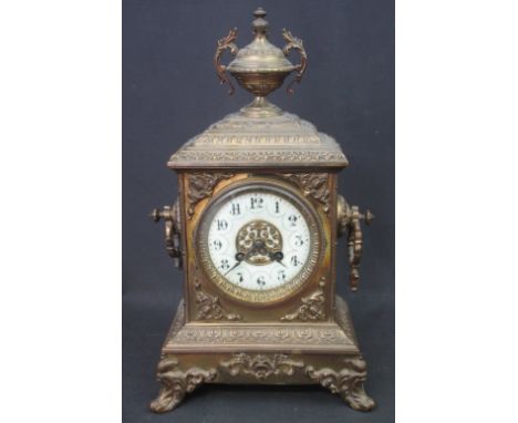 EARLY 20TH CENTURY FRENCH BRASS ARCHITECTURAL MANTEL CLOCK, having urn shaped finial over stepped hood, circular Arabic ceram