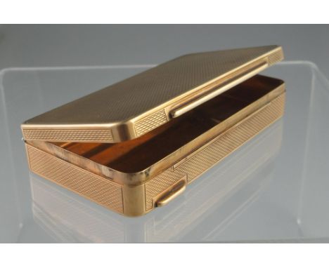 A 9CT GOLD RECTANGULAR BOX. The box having all over engine turned decoration and hinged cover. 8 x 4cm (3" x 1.5"). Weight 63
