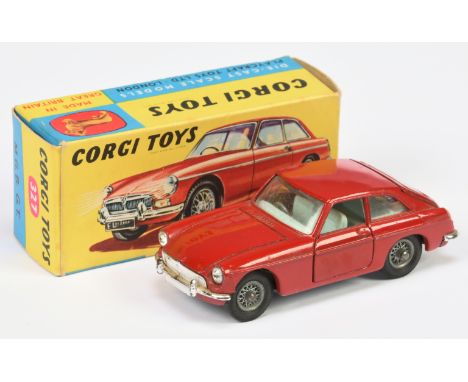 Corgi Toys 327 MGB GT - red body with pale blue interior, chrome trim, wire wheels, small luggage case. Condition is Excellen