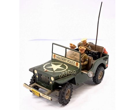 Arnold (Germany) US Army Jeep, dark green, large US star to bonnet, Military Police insignia, with spare wheel and rear Jerry