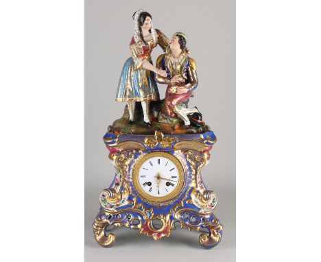 Antique two-part French porcelain Charles Dix figure mantel clock with gold decoration.&nbsp;Monogram JP Eight-day movement, 