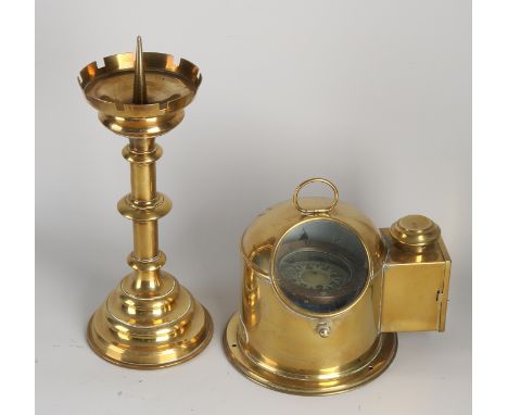 Two parts brassware.&nbsp;20th century.&nbsp;1x Neo-Gothic candlestick.&nbsp;1x Maritime water compass, Bergen Norway.&nbsp;S
