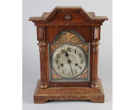 Antique German oak table clock with half-hour strike on gong spring.&nbsp;Marked with 'B'.&nbsp;Circa 1920. Dimensions: H 37 