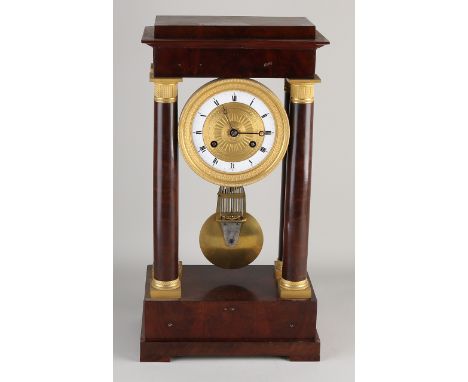 Early 19th century French mahogany column mantel with precision pendulum and blade suspension.&nbsp;Circa 1820. Eight-day mov