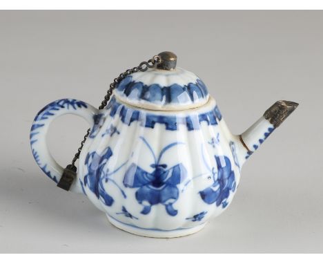 18th Century Chinese porcelain teapot with silver mount and butterfly decoration.&nbsp;Spout glued + lid bottom edge chip.&nb